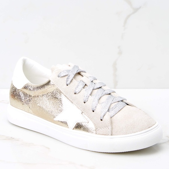 white shoes with gold stars